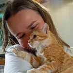 Volunteer at Syros Cats with a blind kitten